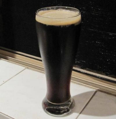 A glass of Cerny Pivo Dark Lager